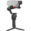 DJI RS 4 handheld gimbal stabilizer with camera mounted, dark gray base and grips
