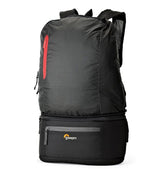 Convertible backpack with front pocket and red zipper accent, black/charcoal fabric