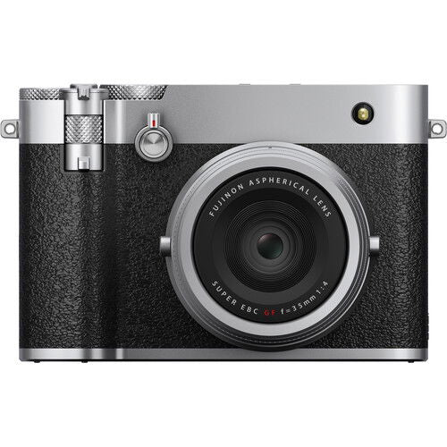 Front view of silver mirrorless camera with large lens and black grip texture