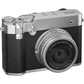 Silver compact medium-format camera with black textured grip and front lens