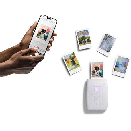 Instax Mini Link 3 printer with multiple mini photos, connected to smartphone