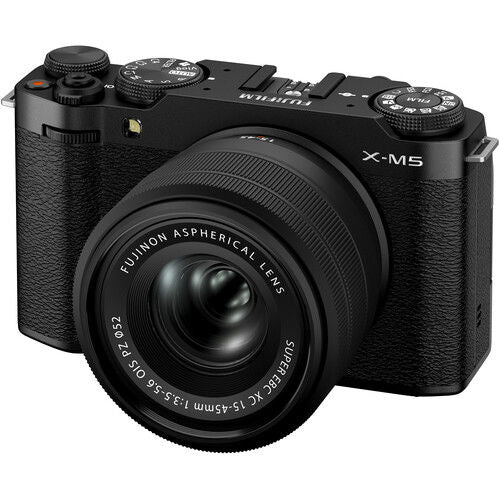Black mirrorless camera with lens, angled front and top controls