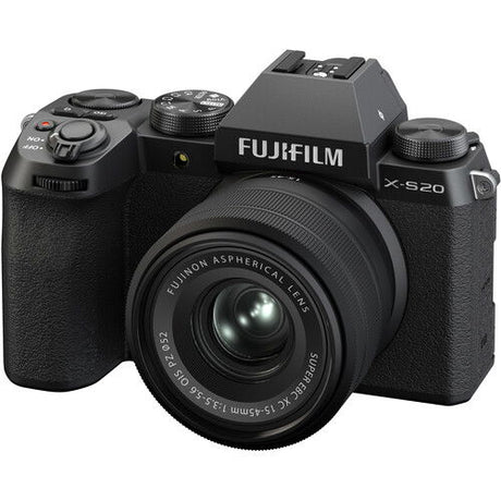 Black mirrorless camera with 15-45mm lens, front-left view, textured grip