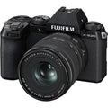Black Fujifilm X-S20 mirrorless camera with attached zoom lens, front view