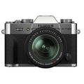 Mirrorless camera with 18-55mm lens, black body and silver top dials