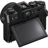 Black mirrorless camera with 15-45mm lens, rear view, tilting LCD screen