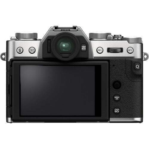 Back view mirrorless camera with LCD screen; silver top controls and black textured body