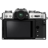 Back view mirrorless camera with LCD screen; silver top controls and black textured body