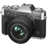 Silver mirrorless camera with 15-45mm lens; front view with textured grip and dials