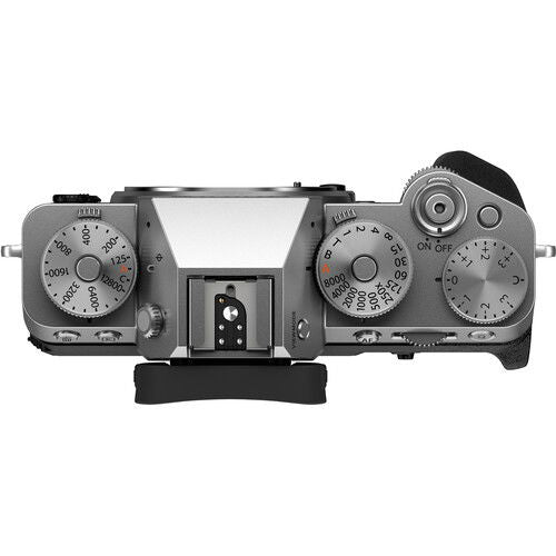 Mirrorless camera body side view, top dials and built-in viewfinder housing