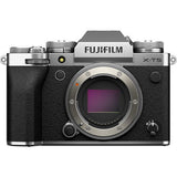 Mirrorless camera body with lens, textured grip, and top control panel