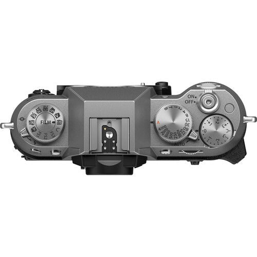 Fujifilm X-T50 camera body side with mode dial and control switches, silver/black