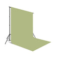 Green seamless photo backdrop backdrop paper, curved edge and folded section visible