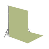 Green seamless photo backdrop backdrop paper, curved edge and folded section visible