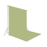 Green seamless photo backdrop with backdrop stand and backdrop sheet draped down