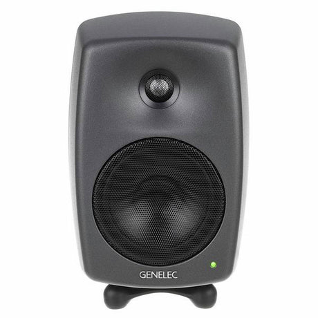 Dark gray active studio monitor speaker, close front view of tweeter and grille