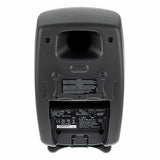 Active studio monitor back panel with connectors, label, and mounting feet, dark gray