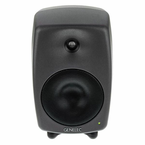 Active studio monitor speaker, tweeter and large woofer grille close-up, dark gray