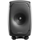Active studio monitor speaker front view with dark cone woofer and curved grille