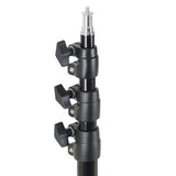 Close-up of black light stand clamps and adjustment knobs on the center column