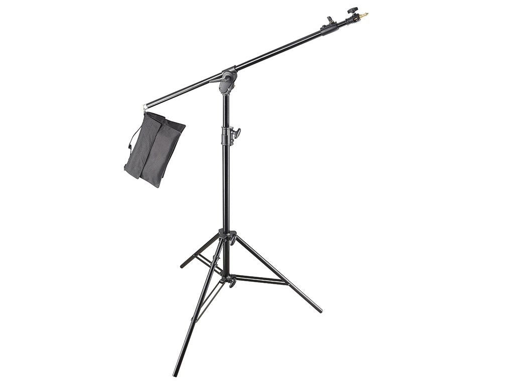 Adjustable light stand with boom arm and hanging sandbag for studio lighting