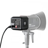 AD-AC power unit for AD600 flash showing rear panel with label and cooling vents