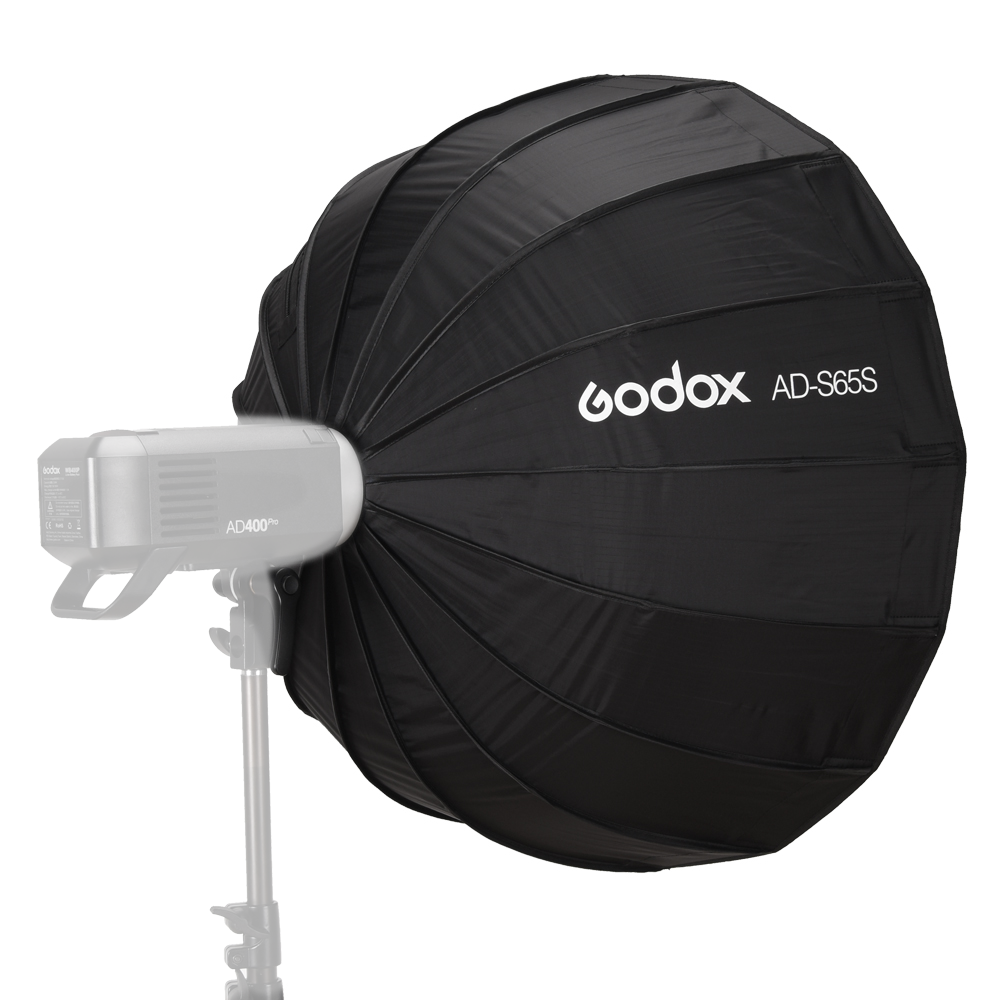 65cm black parabolic softbox with white diffuser fabric, mounted on a studio light