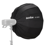 65cm black parabolic softbox with white diffuser fabric, mounted on a studio light