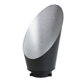 Curved silver reflector with black base and mounting feet for studio lighting