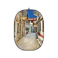 Collapsible oval photo backdrop with printed alley scene