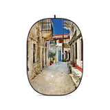 Collapsible oval photo backdrop with printed alley scene