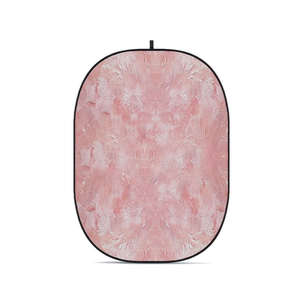 Pink textured oval foldable backdrop with black border and top hanging loop.