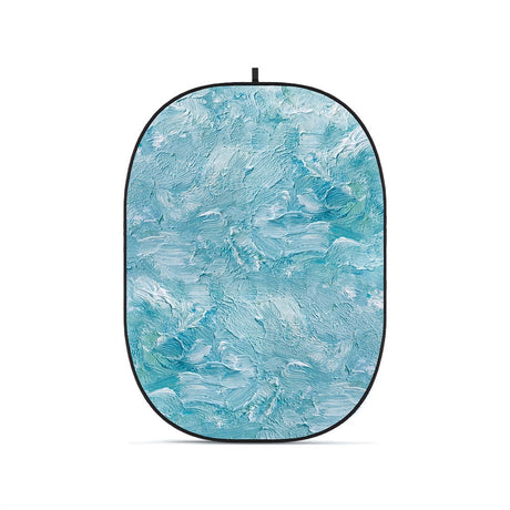 Foldable oval photo backdrop, textured blue surface with black edge
