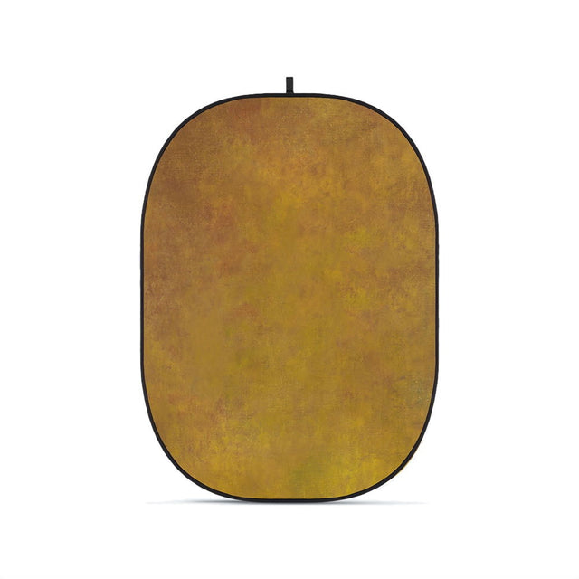 Flexible oval photo backdrop, warm brown/gold fabric with black edge and hanging tab