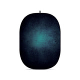 Collapsible oval photo backdrop with dark blue and teal mottled surface