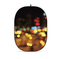 Collapsible oval photo backdrop with colorful bokeh street lights print