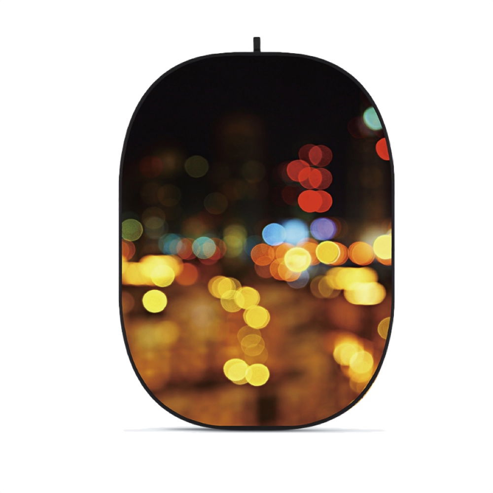 Collapsible oval photo backdrop with colorful bokeh street lights print