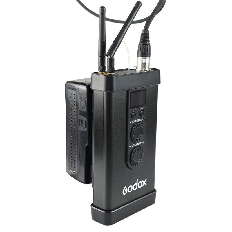 Godox LED controller box with knobs and display, connected to the panel