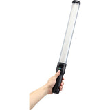 RGB LED light wand in hand, white LED tube and black control handle