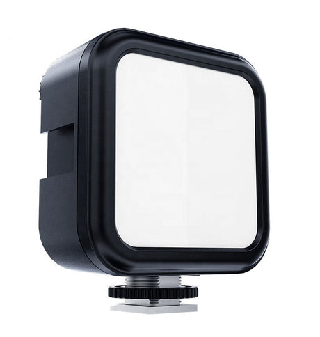 Side view of square LED light head with white diffuser and mounting base