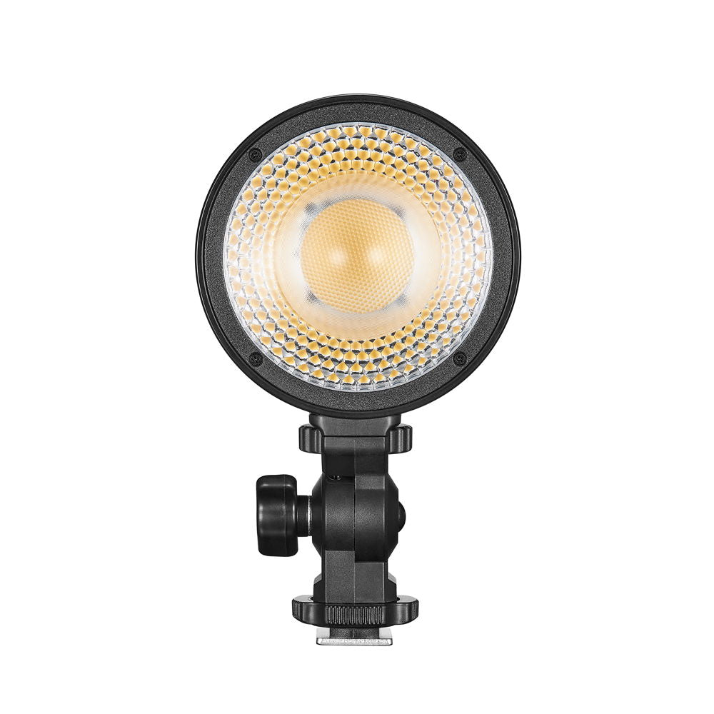 LED video light head with honeycomb lens pattern and stand mount, black body