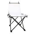 Foldable white photo backdrop with black cross-stand and top side clamps