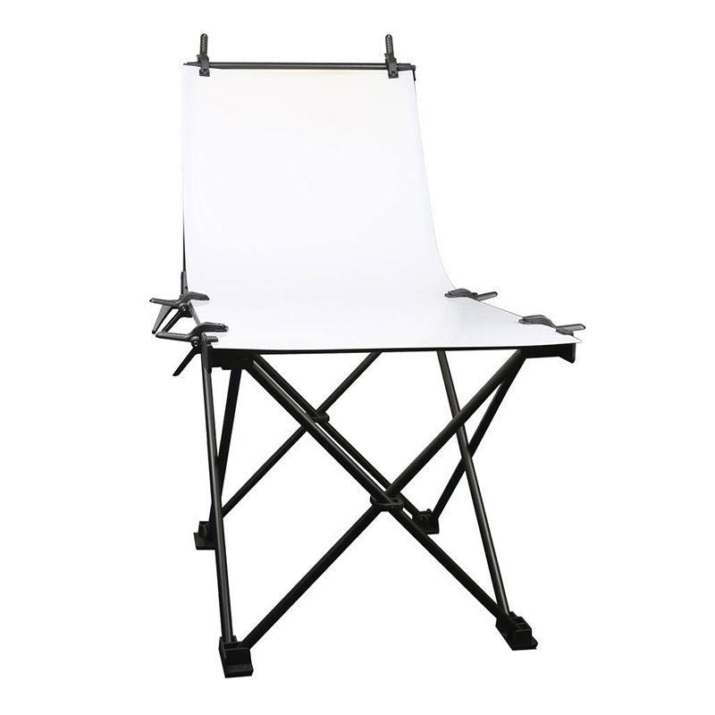Foldable white photo backdrop with black cross-stand and top side clamps