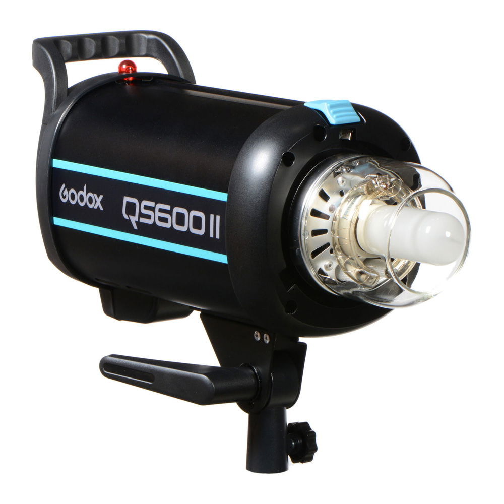 QS600II studio flash head close-up with front lamp and black housing, blue stripe