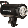 Black studio flash head with round front reflector and safety grille