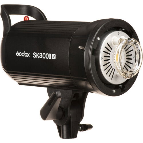 Black studio flash head with round front reflector and safety grille