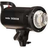 Black studio flash head with round front reflector and safety grille