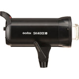 Black studio flash unit side view with front mounting and exposed lamp bulb