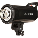 Black studio flash with adjustable reflector housing and visible lamp assembly