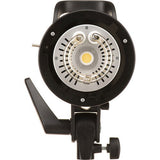 Black studio flash with circular lamp head visible from front-overhead view